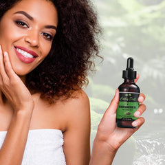 Cathy Doll oil drops on the hair scalp illustrating follicle nourishment.