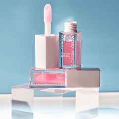 Catrice Glossin' Glow lip oil on lips, showing full shine and plush texture