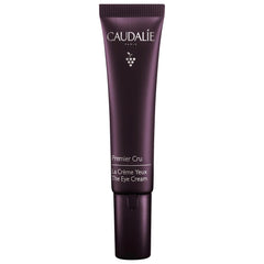 Caudalie Premier Cru eye cream application close-up smoothing the eye area