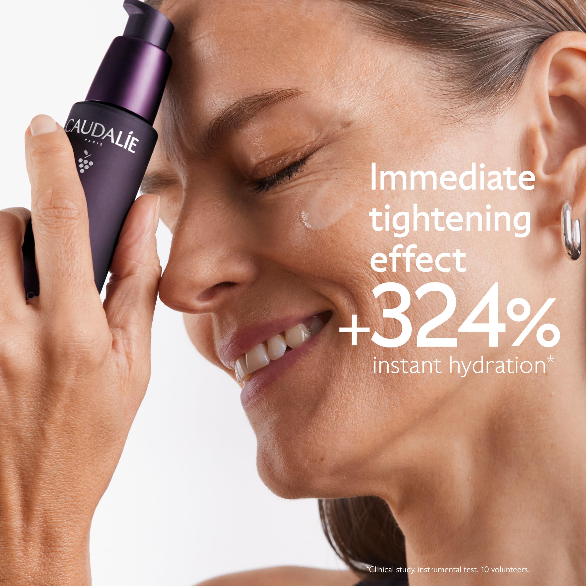 Caudalie Premier Cru serum texture on hand shows silky hydration.