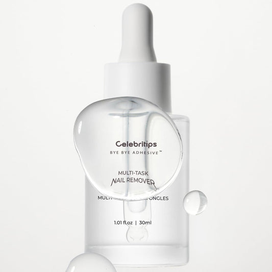 Applying Celebritips Bye Bye Adhesive remover for safe nail cleanup.