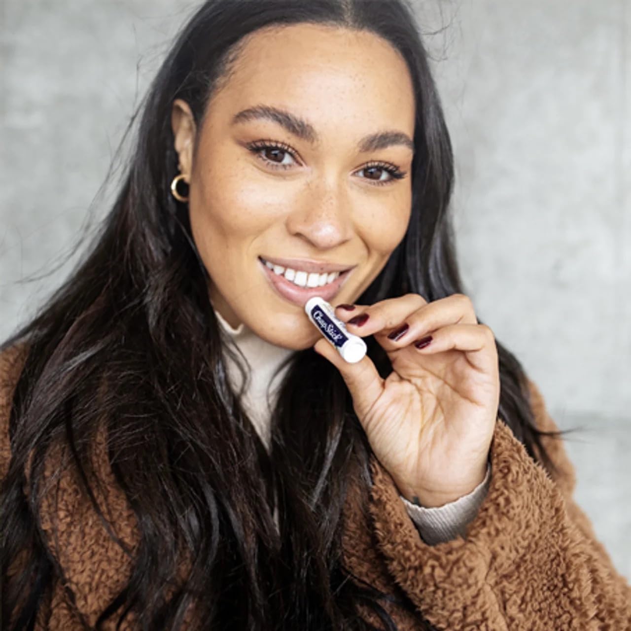 ChapStick Minty Delight tube, smooth glide for dry lips.