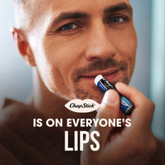 ChapStick Original Moisturizer applied on lips during outdoor activity