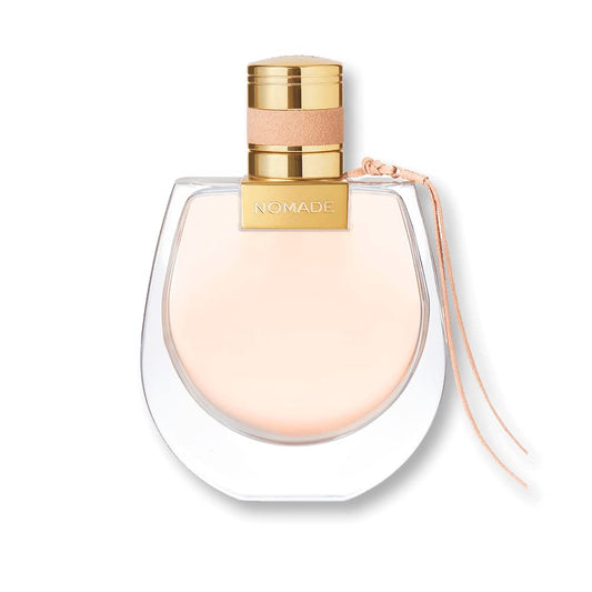 Chloe Nomade Mini bottle on surface for travel-friendly fragrance touch-ups.