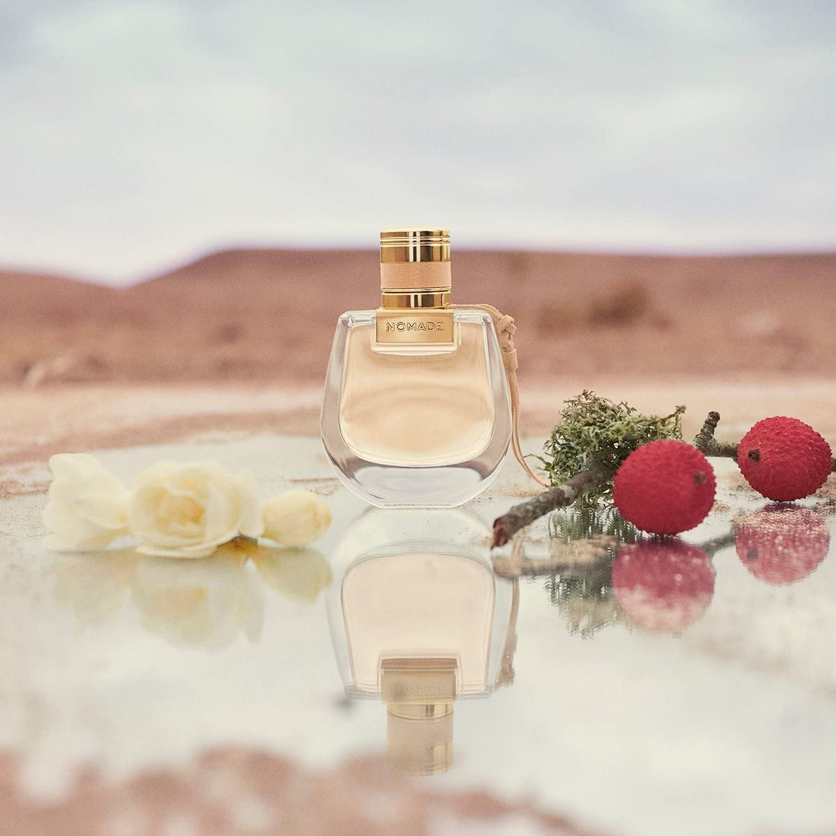 Chloe Nomade Mini travel case scene showing portable fragrance companion.
