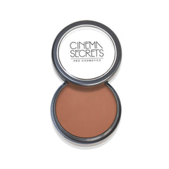 Cinema Secrets Ultimate Foundation bottle close-up highlighting deep red undertones for natural color correction.