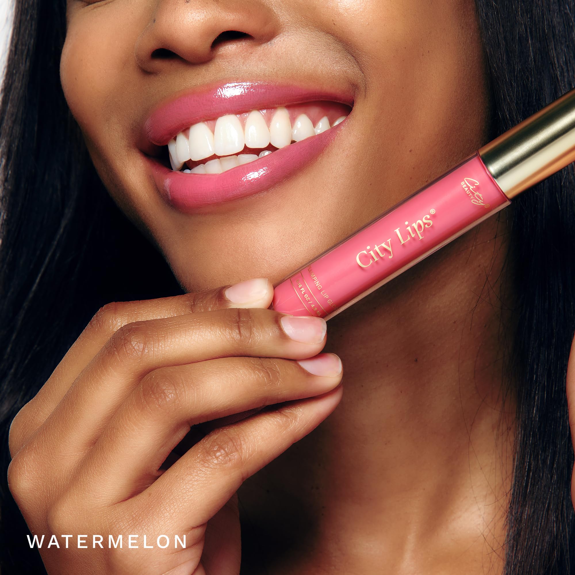 City Beauty City Lips Watermelon gloss swatch reveals luminous color.