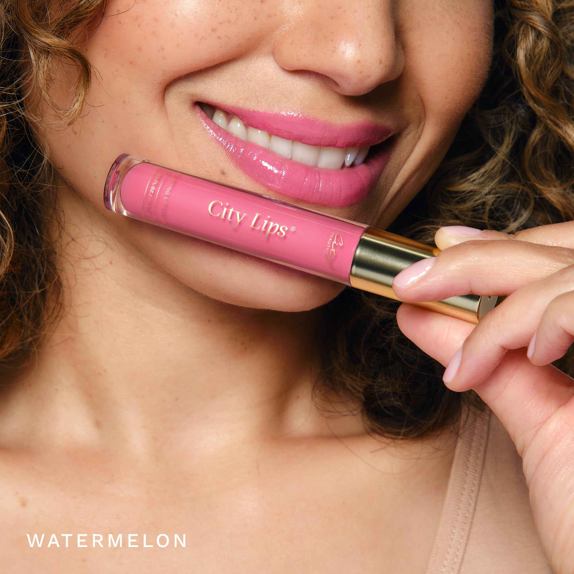 City Beauty City Lips Watermelon gloss tingling sensation signals plump look.