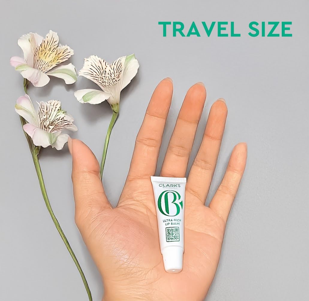 Clark's Botanicals Mini Ultra Rich Lip Balm being applied for smooth, hydrated lips.
