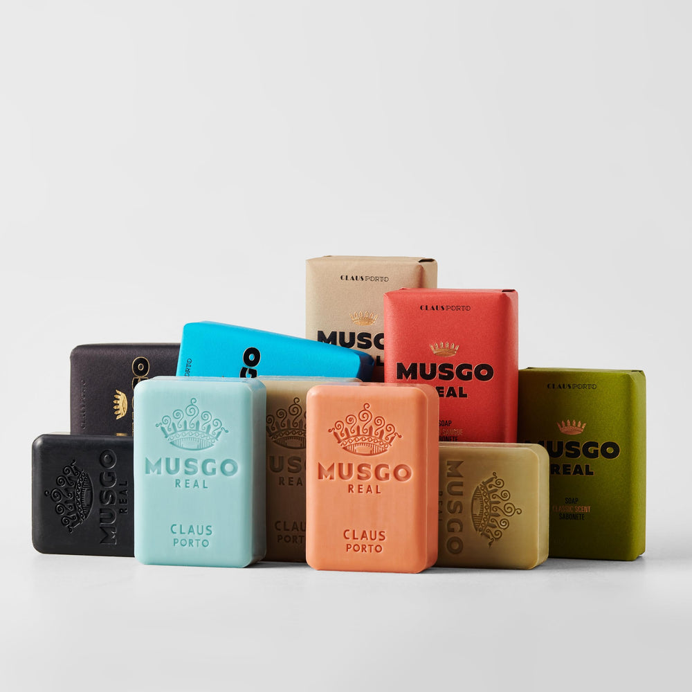 Claus Porto Musgo Real soap bar in hand ready for an invigorating shower cleanse.