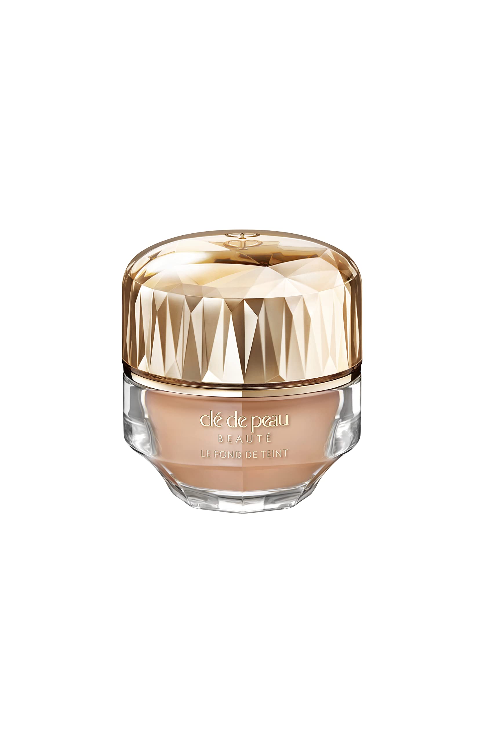 Clé de Peau Beauté Foundation SPF 22 bottle demonstrates radiant, even-toned skin.