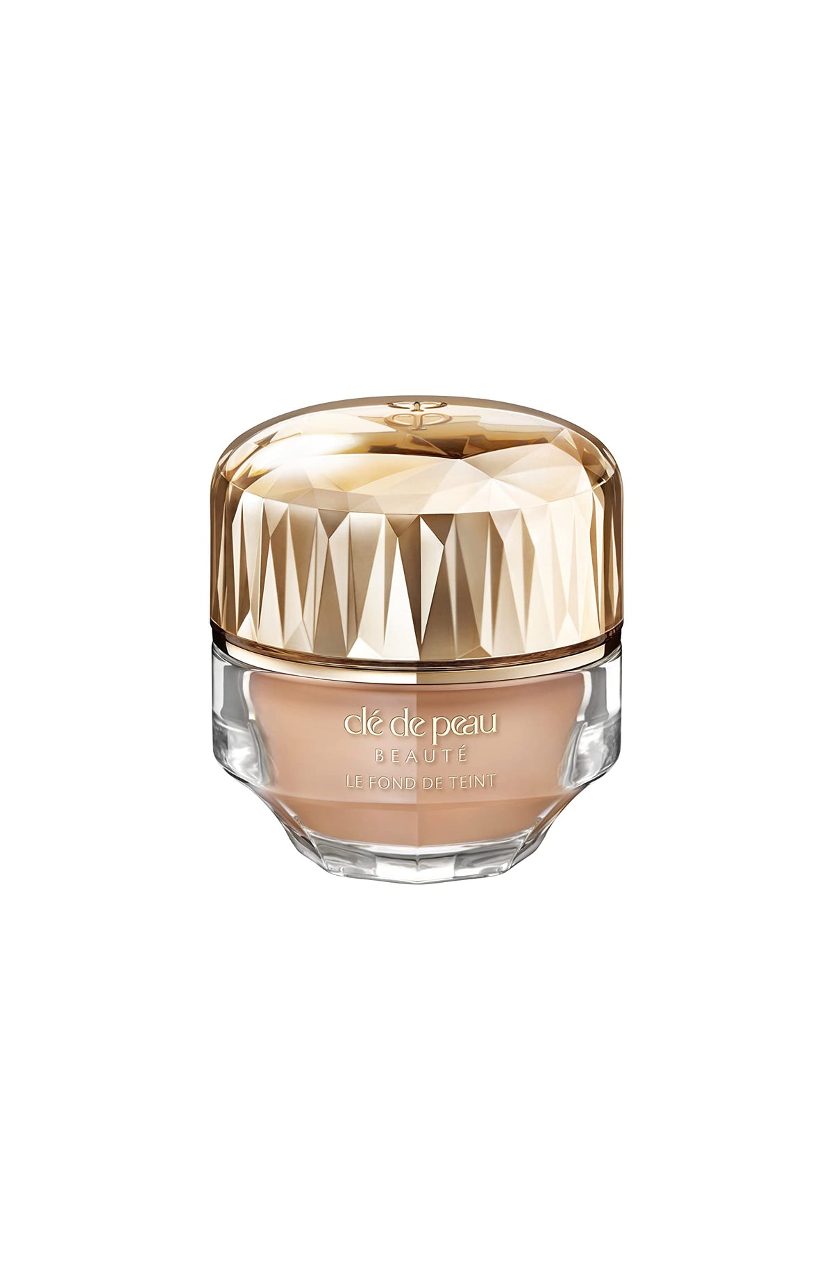 Clé de Peau Beauté Foundation SPF 22 bottle demonstrates radiant, even-toned skin.