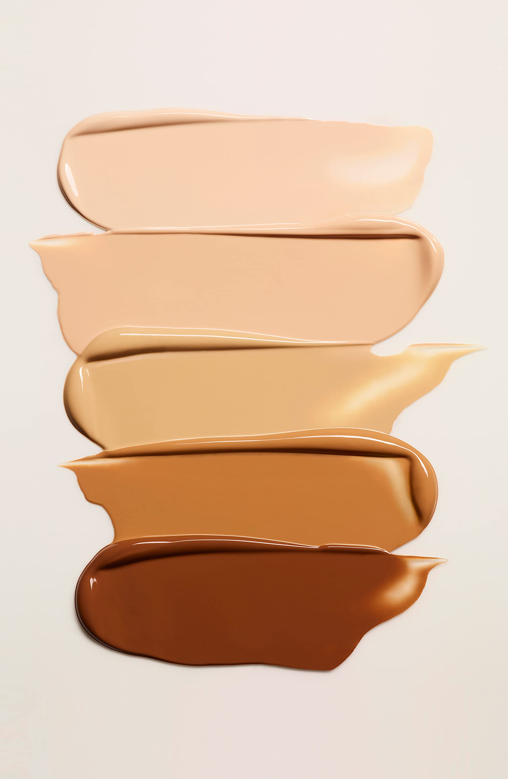 Clé de Peau Beauté Radiant Cream Foundation close-up captures smooth texture and light-reflecting glow