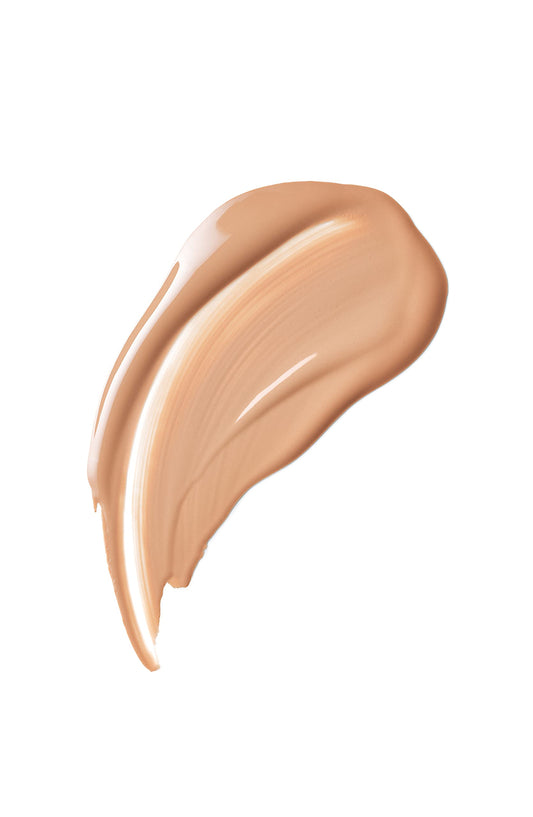 Cle de Peau Beauté Radiant Fluid Foundation texture spread highlights smooth, even coverage.