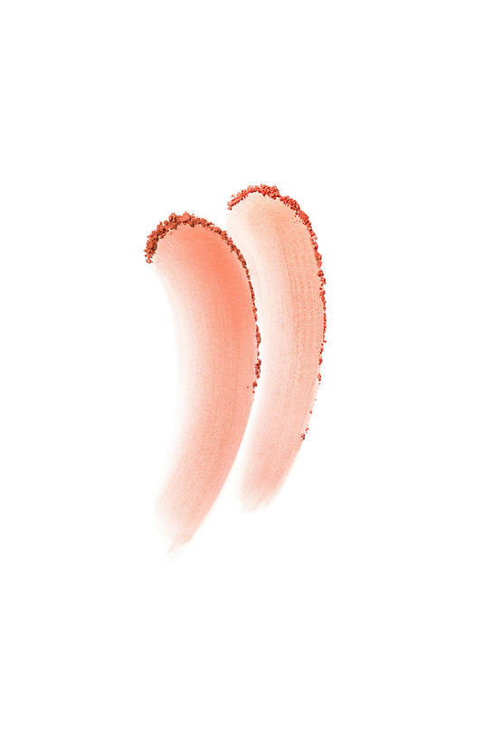 Clé de Peau blush duo Peach Tulip 103 close-up shows ultra-fine powder for buildable color.