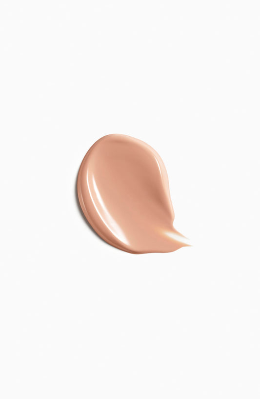 Clé de Peau foundation bottle with SPF 22 label highlighting sun protection.
