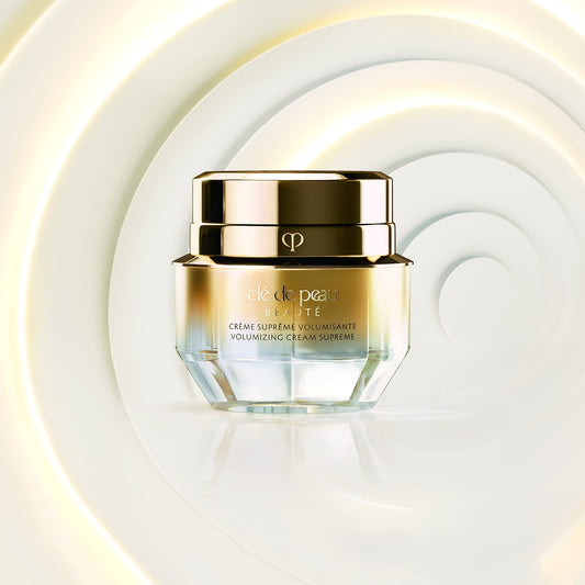 Clé de Peau Beauté mini volumizing cream supreme packaging demonstrates compact, travel-friendly size.