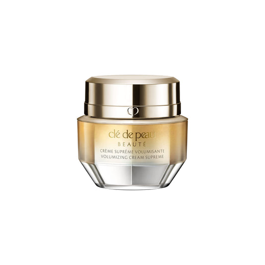 Clé de Peau Beauté mini volumizing cream supreme texture closeup shows silky feel for luxurious application.