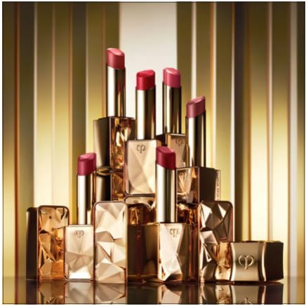 Applying Cle de Peau Shade 1 with a lip brush for precision.
