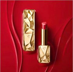 Clé de Peau Beauté The Precious Lipstick Shade 2 on lips delivers versatile color with a satin finish.