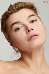 Application of Clé de Peau Radiant Fluid Foundation BF10 for smooth blend