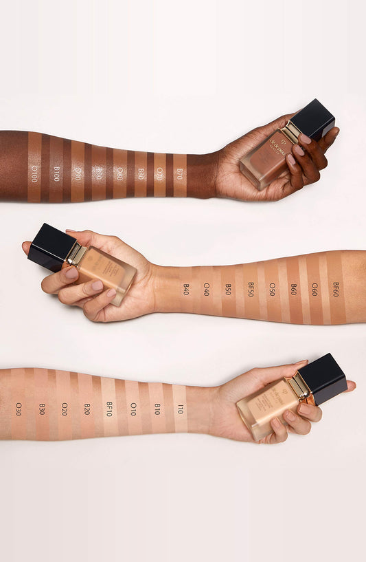 Texture close-up of Clé de Peau Radiant Fluid Foundation Matte BF10 with silky finish