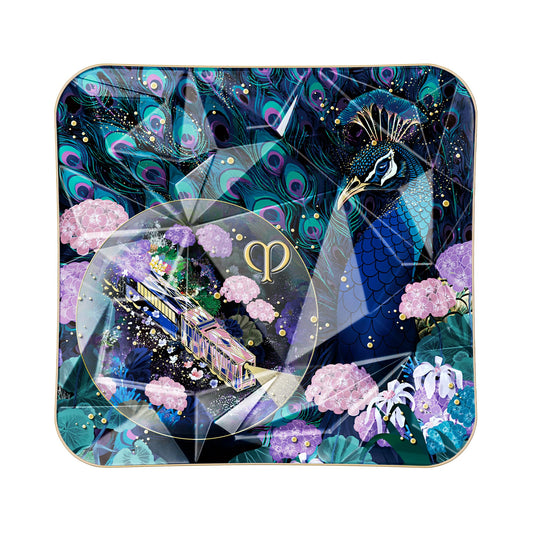 Clé de Peau Beauté Radiant Peafowl shade swatch showing iridescent glow for daytime radiance.