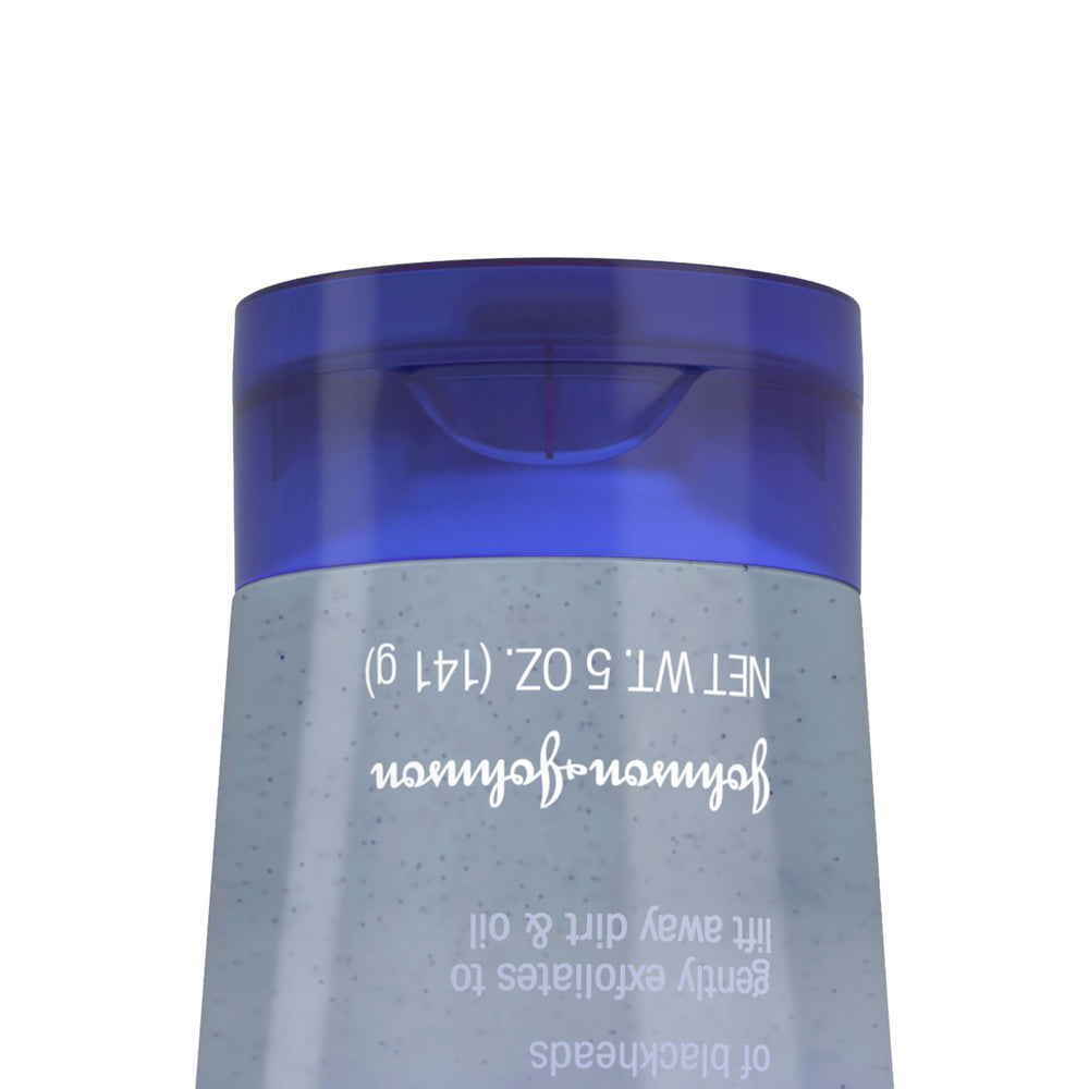 Clean & Clear applying scrub on face for daily acne-prone skin routine.