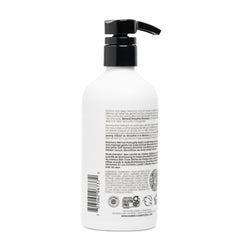 16 oz bottle of Clean Kids Naturally Tropical Shampoo on the sink.