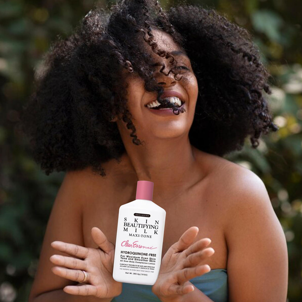 Cream swirl reveals rich milk-based texture of Clear Essence lotion.