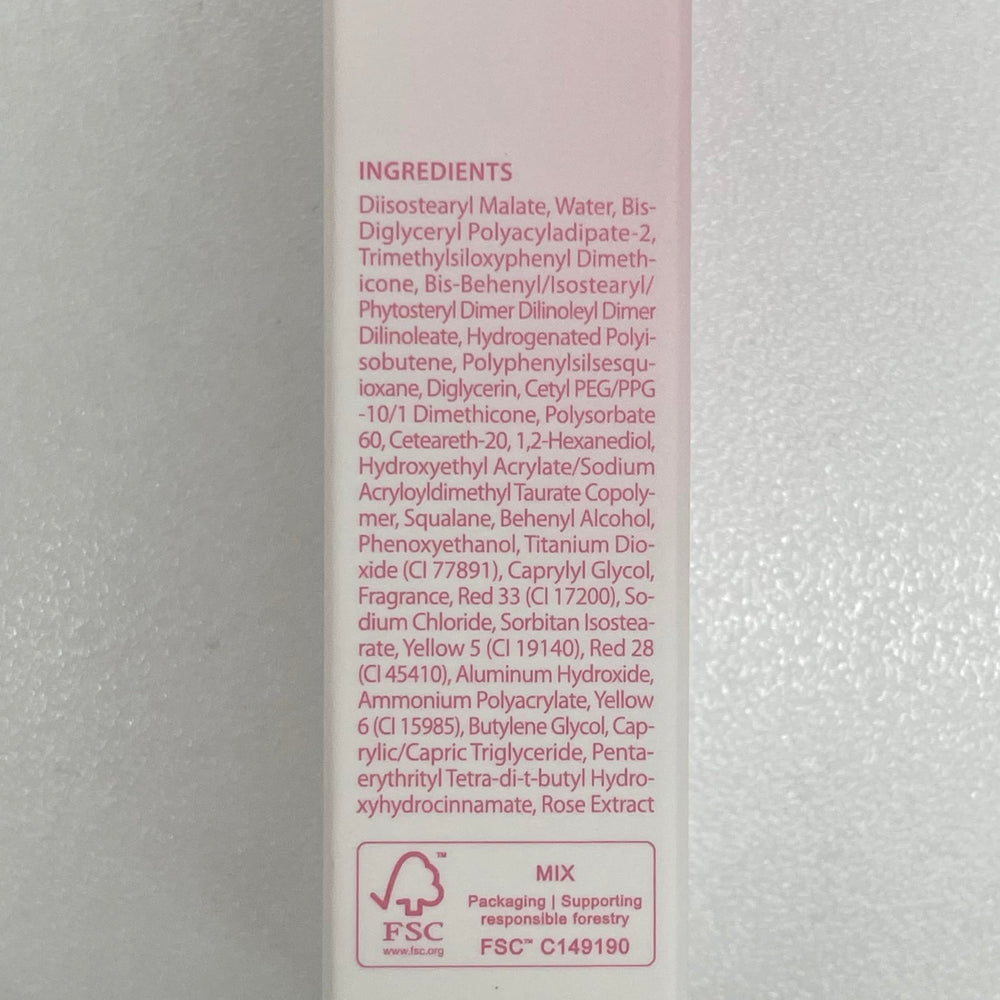 CLIO PROFESSIONAL size comparison next to coin illustrating compact travel-friendly tube