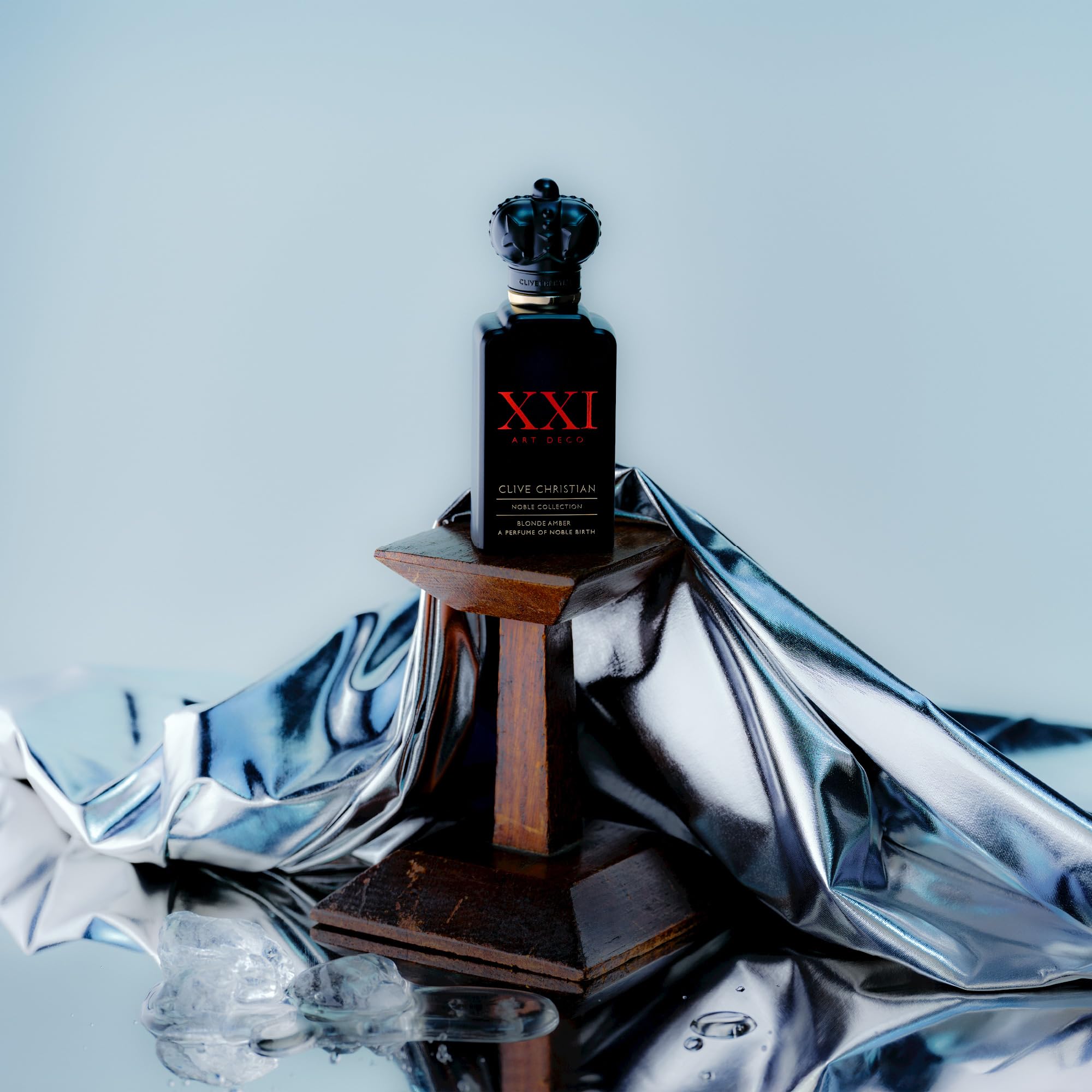 Clive Christian XXl Noble Blonde Amber crown-cap bottle highlights heritage and sophistication.