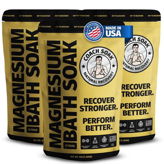 Coach Soak Recovery Bath Soak bottle pouring magnesium flakes for post-workout relaxation.