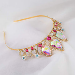 COCIDE pearl rhinestone headband shines under lights during pageants.