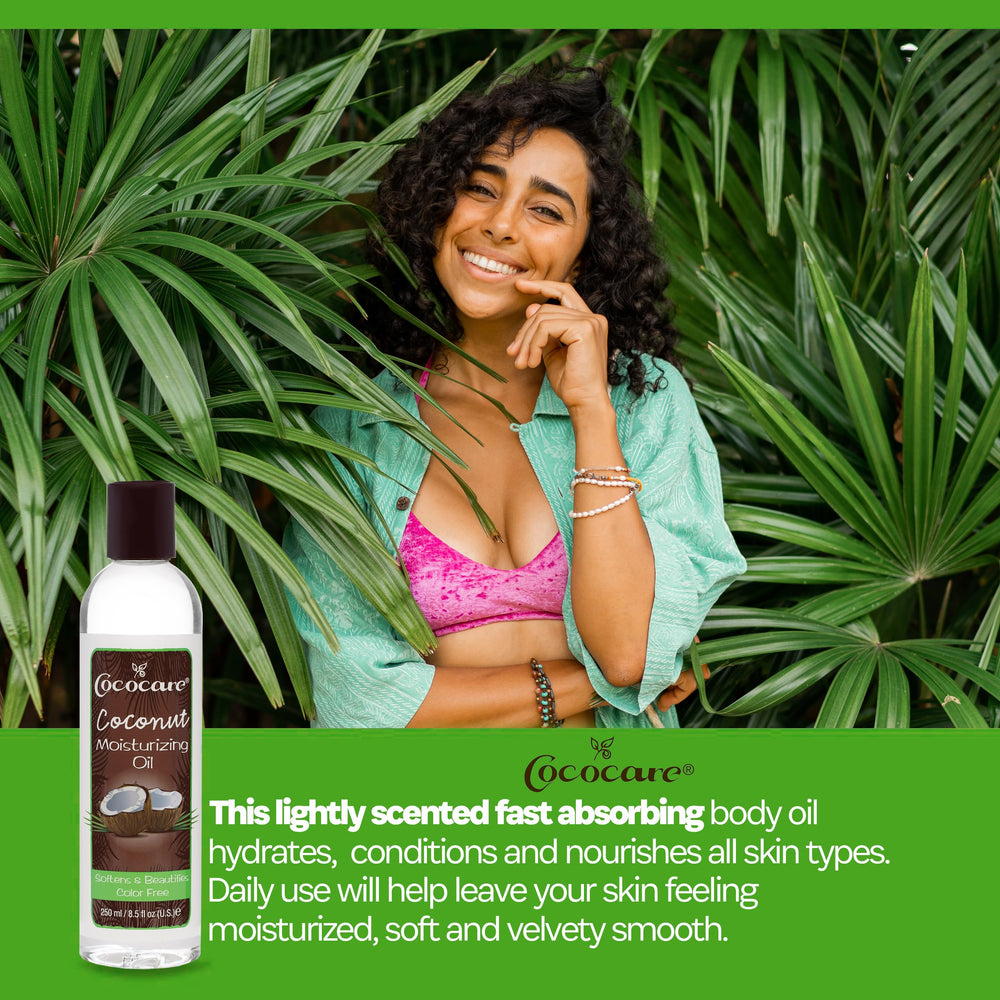 COCOCARE Coconut Moisturizing Oil being applied by hand for smooth, nourished skin.