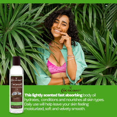 COCOCARE Coconut Moisturizing Oil being applied by hand for smooth, nourished skin.