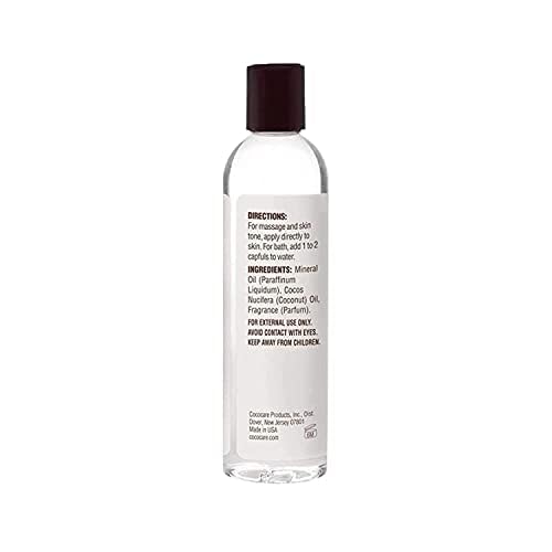COCOCARE Coconut Moisturizing Oil label close-up indicating product benefits and usage.