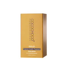 Cocochoco Gold keratin treatment being applied with a flat iron to seal moisture.