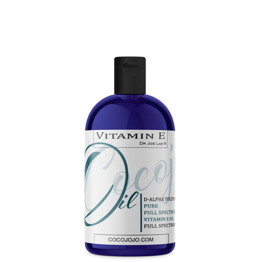 Cocojojo Vitamin E Oil bottle closeup for skin and hair nourishment.