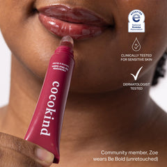 Cocokind Lip Blur Balm on lips highlighting smooth shine and moisture