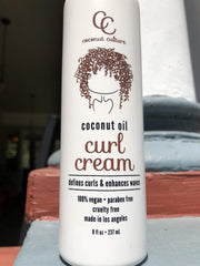 Coconut Culture Curl Cream hands-on application on wet hair for frizz control.