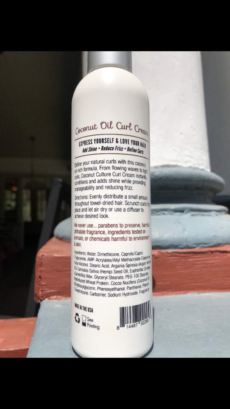 Close-up of smooth curls with Coconut Culture Curl Cream for shine and definition.