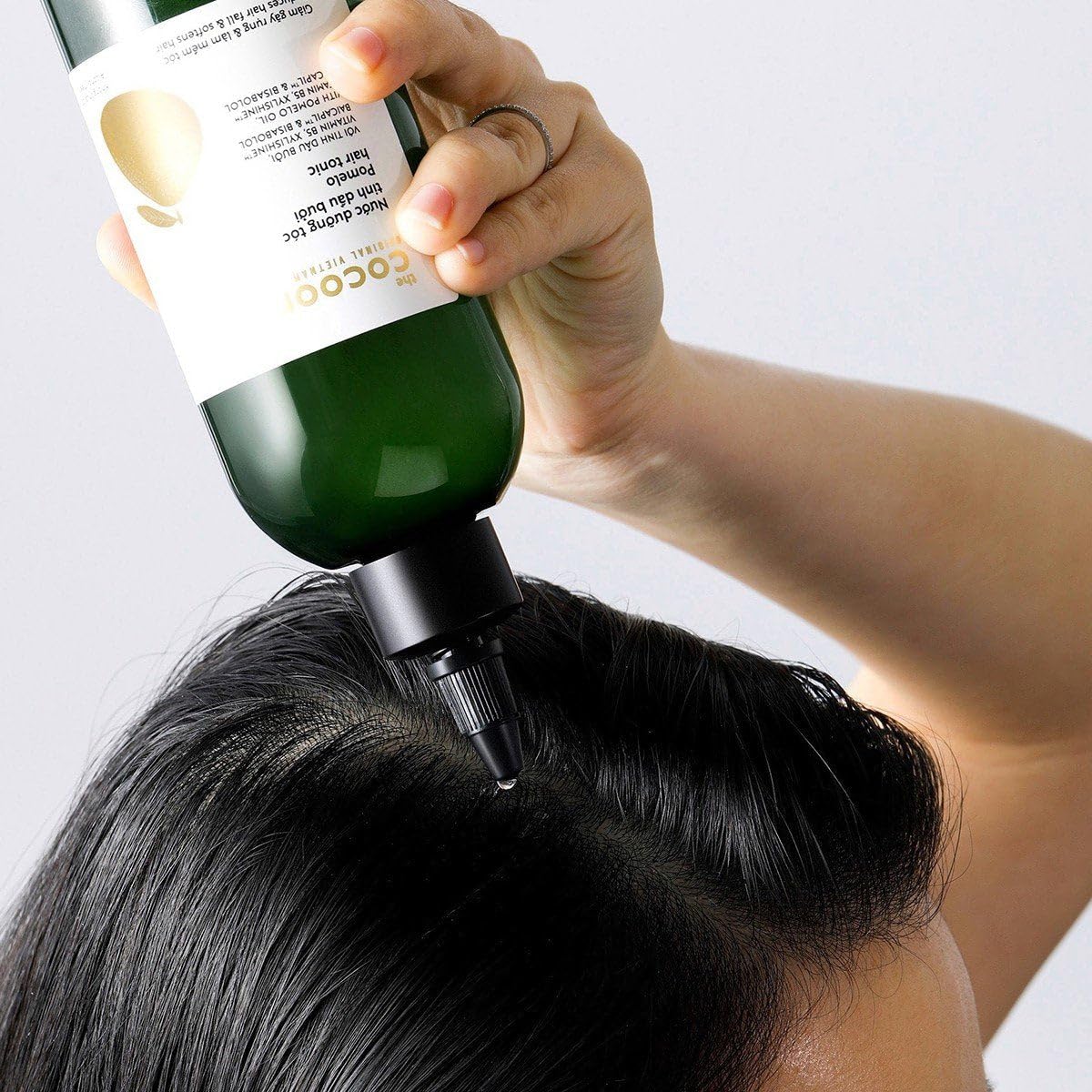 Cocoon Original Pomelo Oil Hair Tonic vegan cruelty-free badge closeup