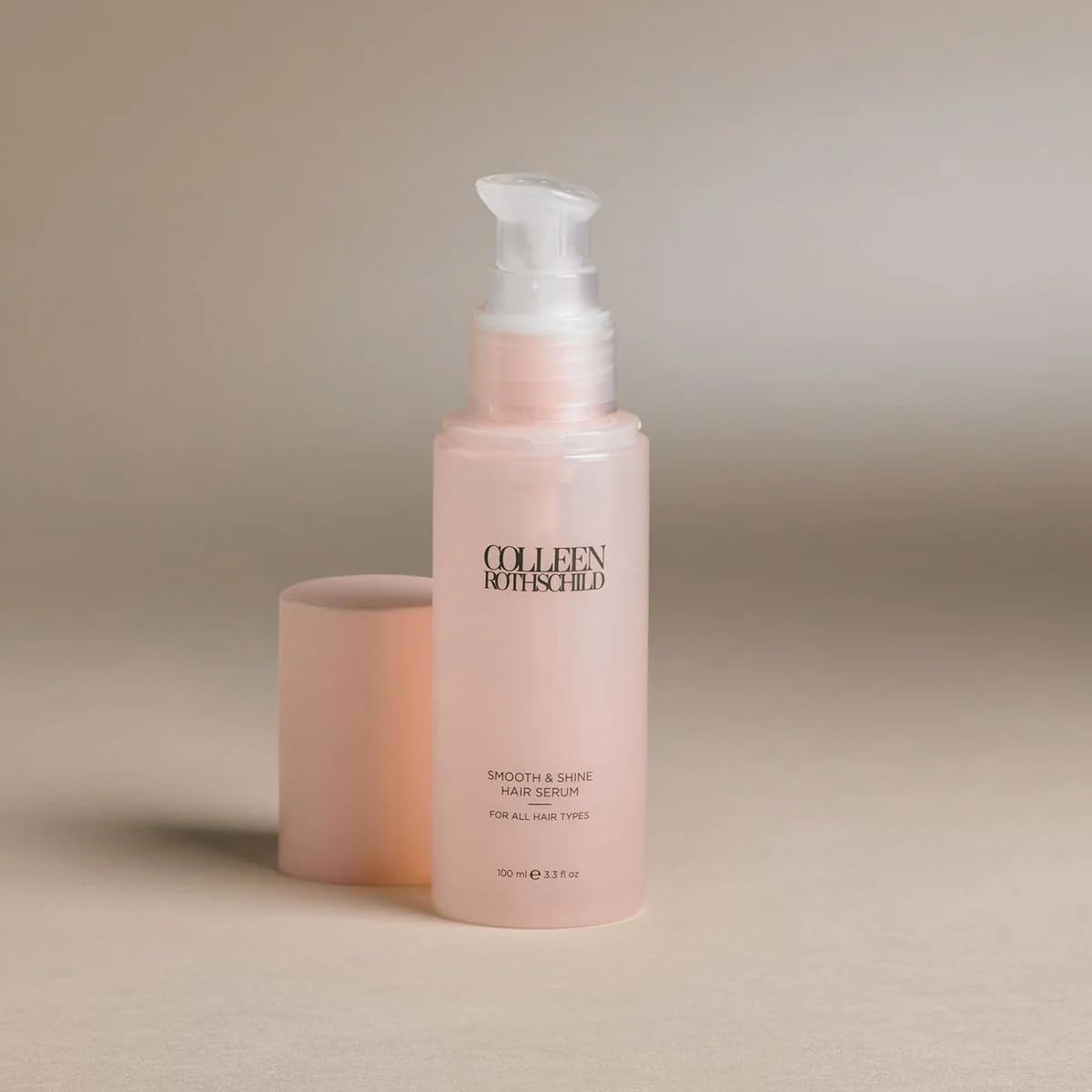 COLLEEN ROTHSCHILD Smooth and Shine serum on hair strands delivering instant softness.
