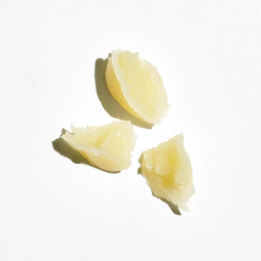 COLLEEN ROTHSCHILD Universal Rescue Balm dispensing, transforming into a silky liquid-gold oil on skin.