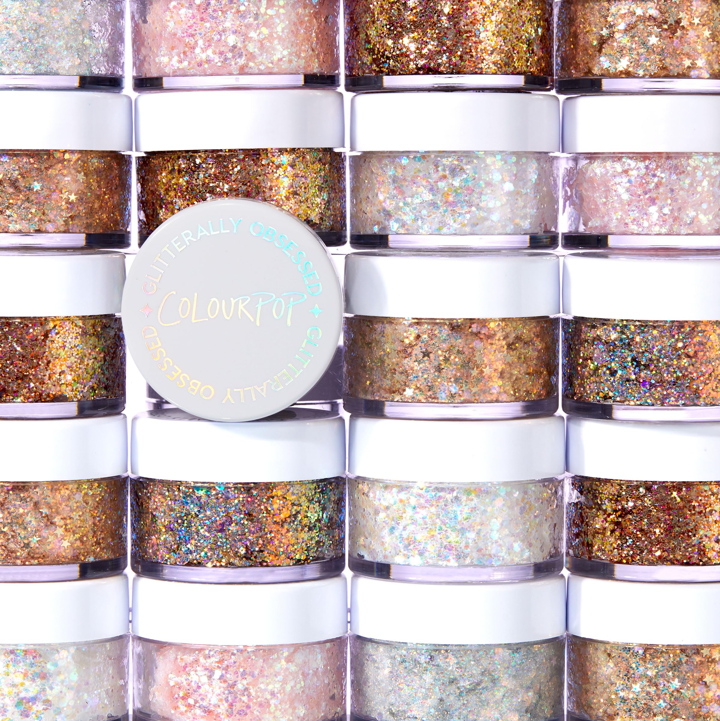 ColourPop Glitterally Obsessed Body Glitter Gel on cheeks creates reflective highlight.