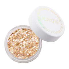 ColourPop Glitterally Obsessed Body Glitter Gel accents collarbone with vibrant sparkles.