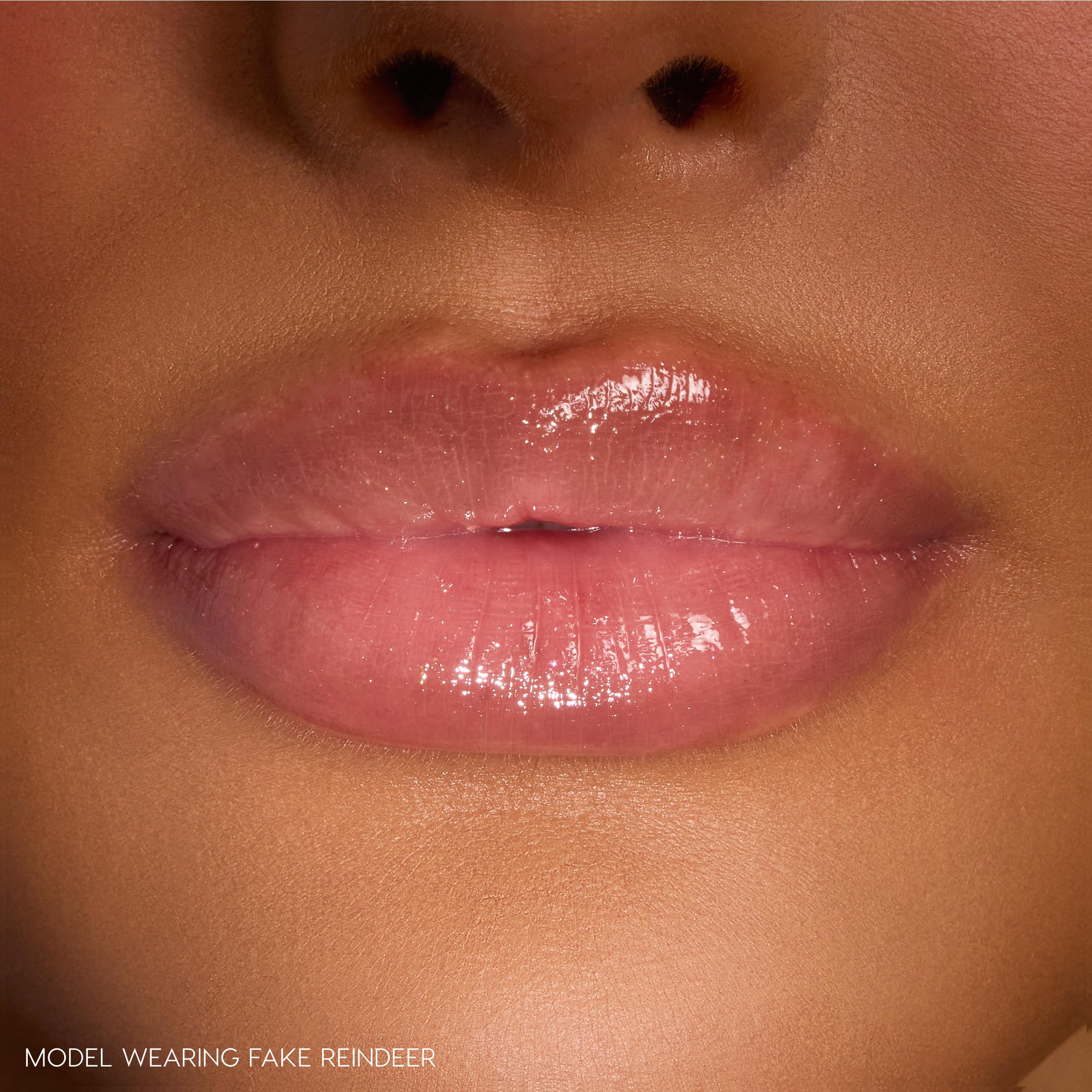 ColourPop Grinchmas Swirl gloss on lips shows non-sticky shine and soft, hydrated feel.