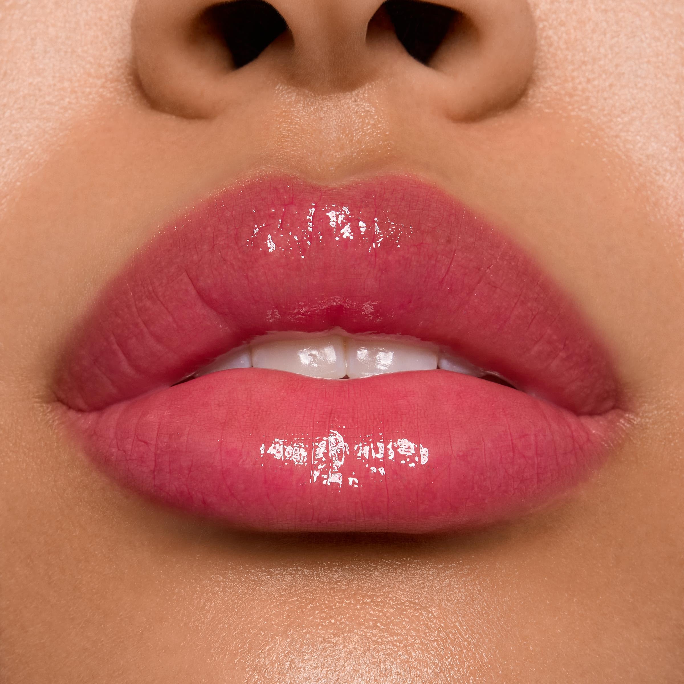 ColourPop Stitch lip gloss pearlescent finish adds shimmer and dimension.