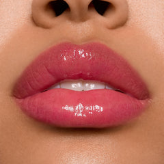 ColourPop Stitch lip gloss pearlescent finish adds shimmer and dimension.